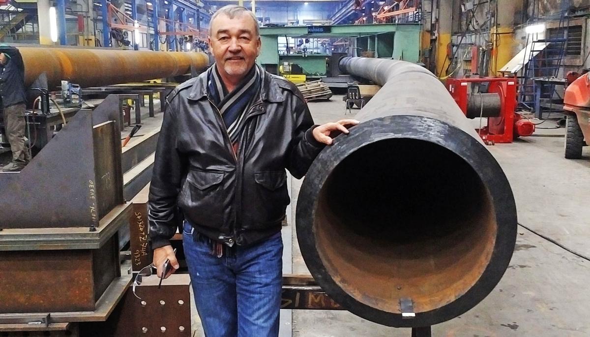 Kubes Steel Founder & Owner, Joe Kubes with a 30" pipe bent by Kubes Steel