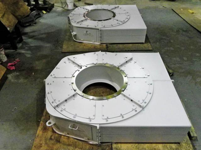 A Set Of Large Rectangular Custom Assemblies With A Circular Housing Area For A Fan Rotor Shaft