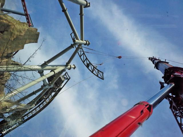 Looking Up Along The Arm Of A Crane Lifting A Section Of Roller Coaster Track Into Position During Construction Of Canada's Wonderland's "The Guardian"