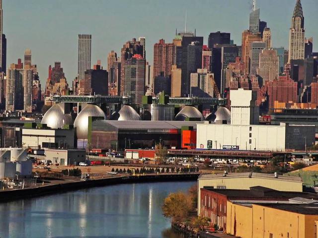Newtown Creek Waste Treatment Plant's Digester Eggs with the New York City skyline in the background.