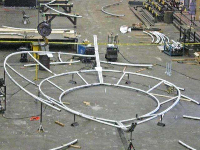Assembled Rolled Stainless Steel Pipes In A Workshop Forming A Circular Shape For The Sculpture "Wisdom"