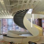 A Custom Curved Staircase Being Installed At A Building Site