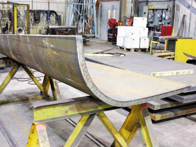 A Heavy Piece Of Plate Steel Formed To A Smooth 90 Degree Bend By A Press Brake