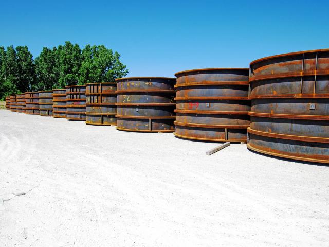 Rows Of Custom Fabricated Elevator Shaft Liners Sit In A Shipping Yard