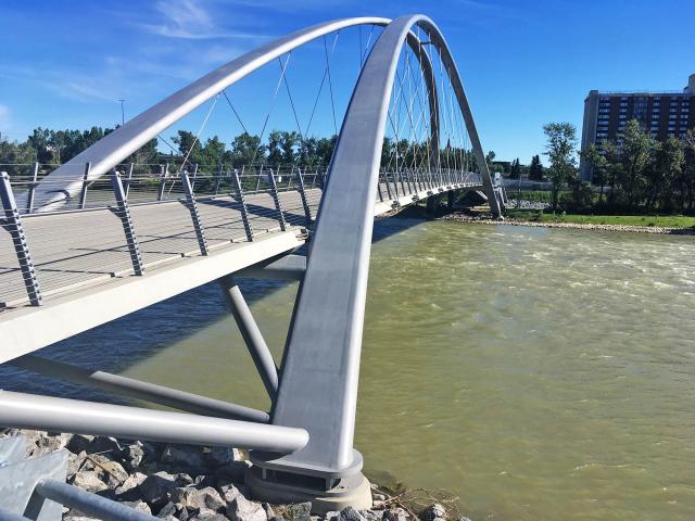 The Double Arched "George C. King" Suspension Bridge in Calgary, Alberta, Canada, Featuring Custom Rolled Structural Steel Pipes