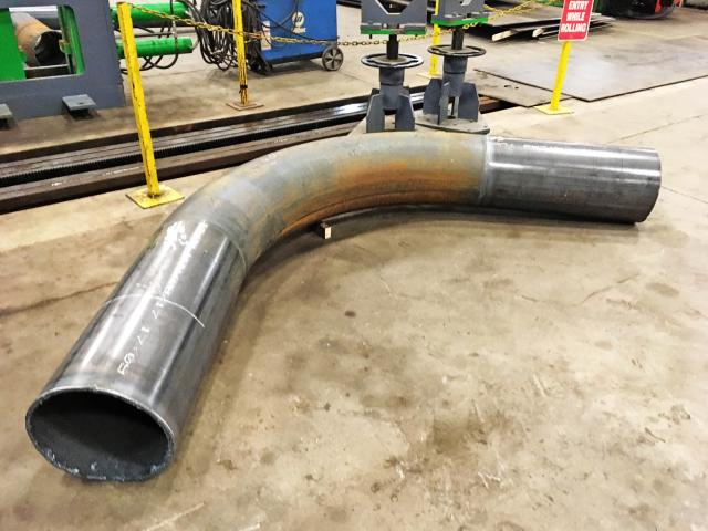A Section Of Large Diameter Pipe Formed To A 90 Degree Angle Via Induction Bending