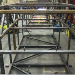A Large Custom Fabricated Industrial Frame Made Of Square Steel Structural Sections Under Construction