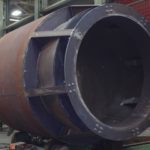A Custom Fabricated Cylinder With Internal Flaring At One End Designed For An Industrial Gas Exhaust Stack