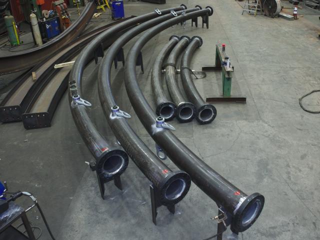 A Set Of Custom Fabricated Curved Heavy Pipe Sections With End Connectors Which Assemble Into A Complete Ring