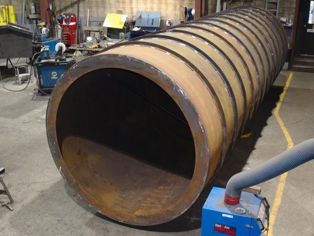 A Long Combustion Tube Fabricated From A Series Of Custom Rolled Large Diameter Ring Sections