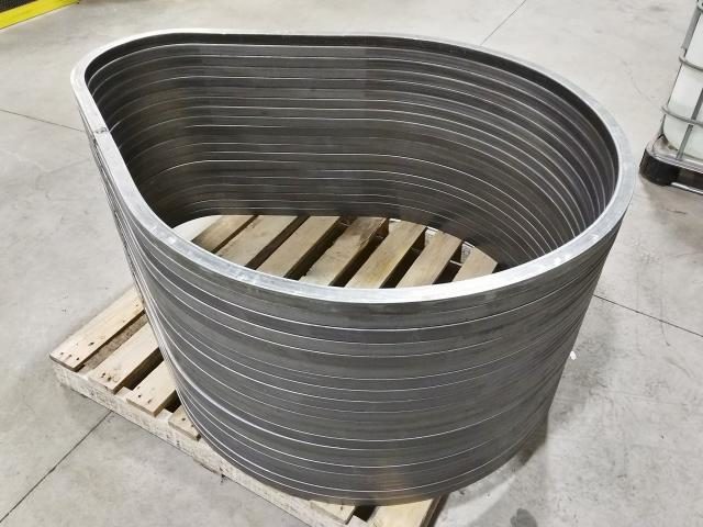 Completed Sections Of Square Steel Formed Into Large Tear Drop Shapes Are Stacked For Shipping