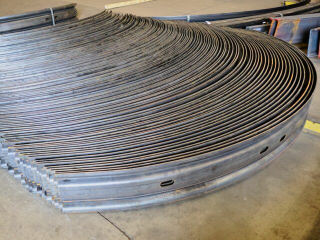 Completed Sections Of Custom Corrugated Steel Sit On A Shop Floor