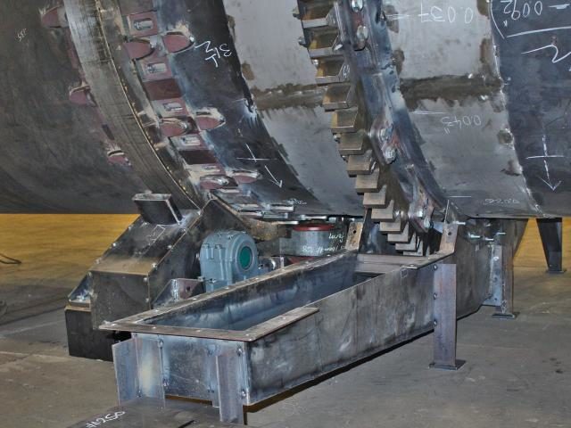 A Custom Fabricated Gearing System With Oil Pan And Covers To Rotate An Industrial Drum Dryer Shell For Materials Handling