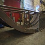 A Large Custom Fabricated Modular Section Of Curved Plate With Internal Bracing And Connecting Flanges