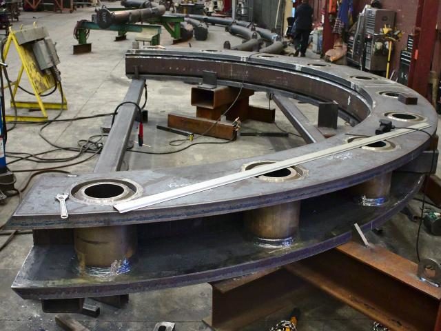 Custom Fabricated Heavy Segmented Ring Assemblies Accompany Heavy Braced Curved Plate Sections