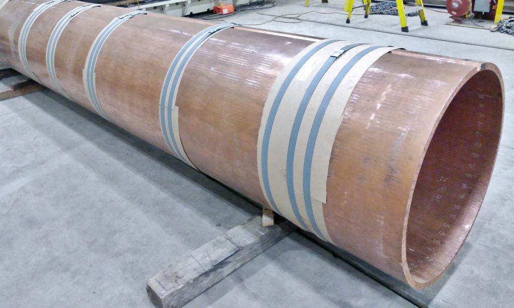 A 17' Long Section Of Heavy Copper Plate Is Custom Formed Into A Cylinder