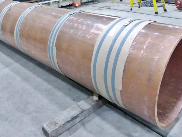 A 17' Long Section Of Heavy Copper Plate Is Custom Formed Into A Cylinder