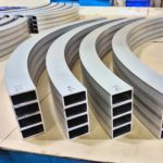 Custom Curved Aluminum Hollow Structural Sections Stacked For Shipping