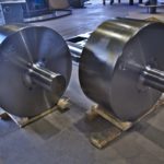 Two Custom Fabricated Solid Steel Circular Rollers With Central Connection Shafts