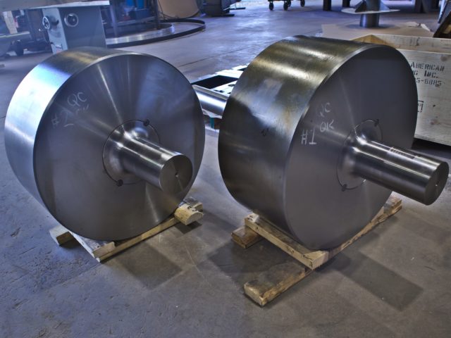 Two Custom Fabricated Solid Steel Circular Rollers With Central Connection Shafts