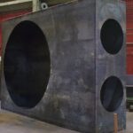 A Custom Fabricated Fan Housing With Ducting Connectors And A Set Of Custom Steel Ducting Sections