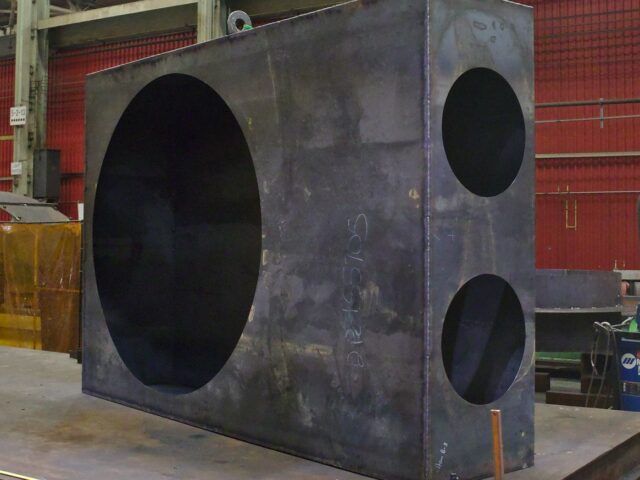 A Custom Fabricated Fan Housing With Ducting Connectors And A Set Of Custom Steel Ducting Sections