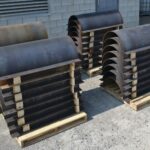 Secciones de revestimiento de tuberías subterráneas fabricadas a medida formadas a partir de láminas de acero embaladas para su envío en Kubes Steel