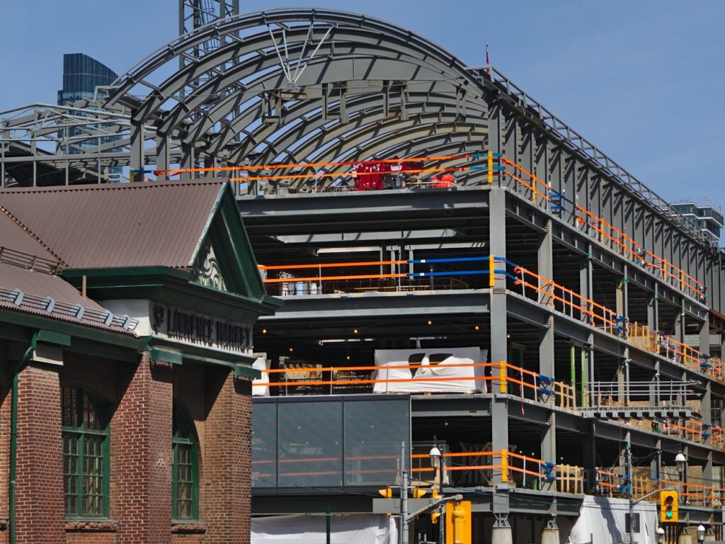 Two Buildings Under Construction At Toronto's St. Lawrence Market North With Matching Custom Curved Structural Roof Beams