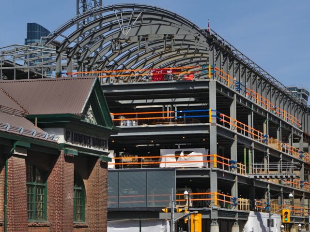 Two Buildings Under Construction At Toronto's St. Lawrence Market North With Matching Custom Curved Structural Roof Beams