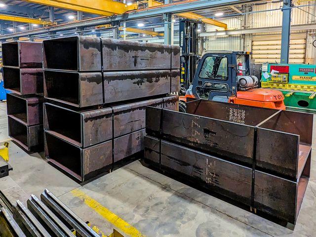 Half Inch Plate Sections Formed Into U Shapes With Flat Bottoms For The Nuclear Power Industry Are Packed Up For Shipping.
